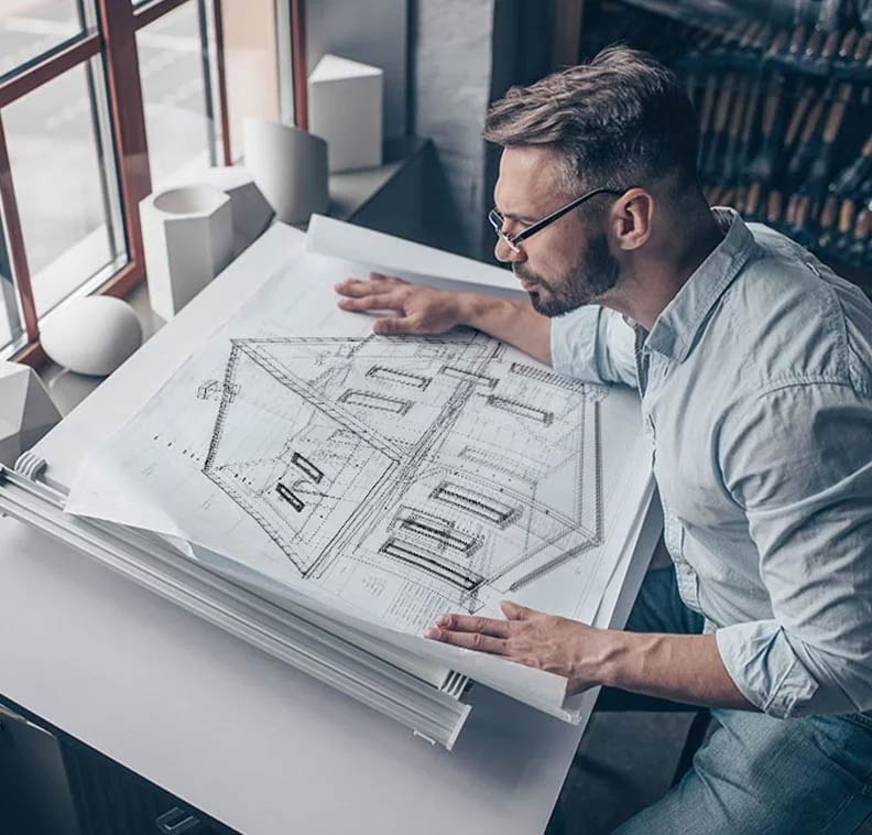 Architect inspecting building plans